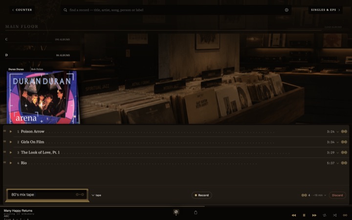 Recording a tape from records on the shelf.