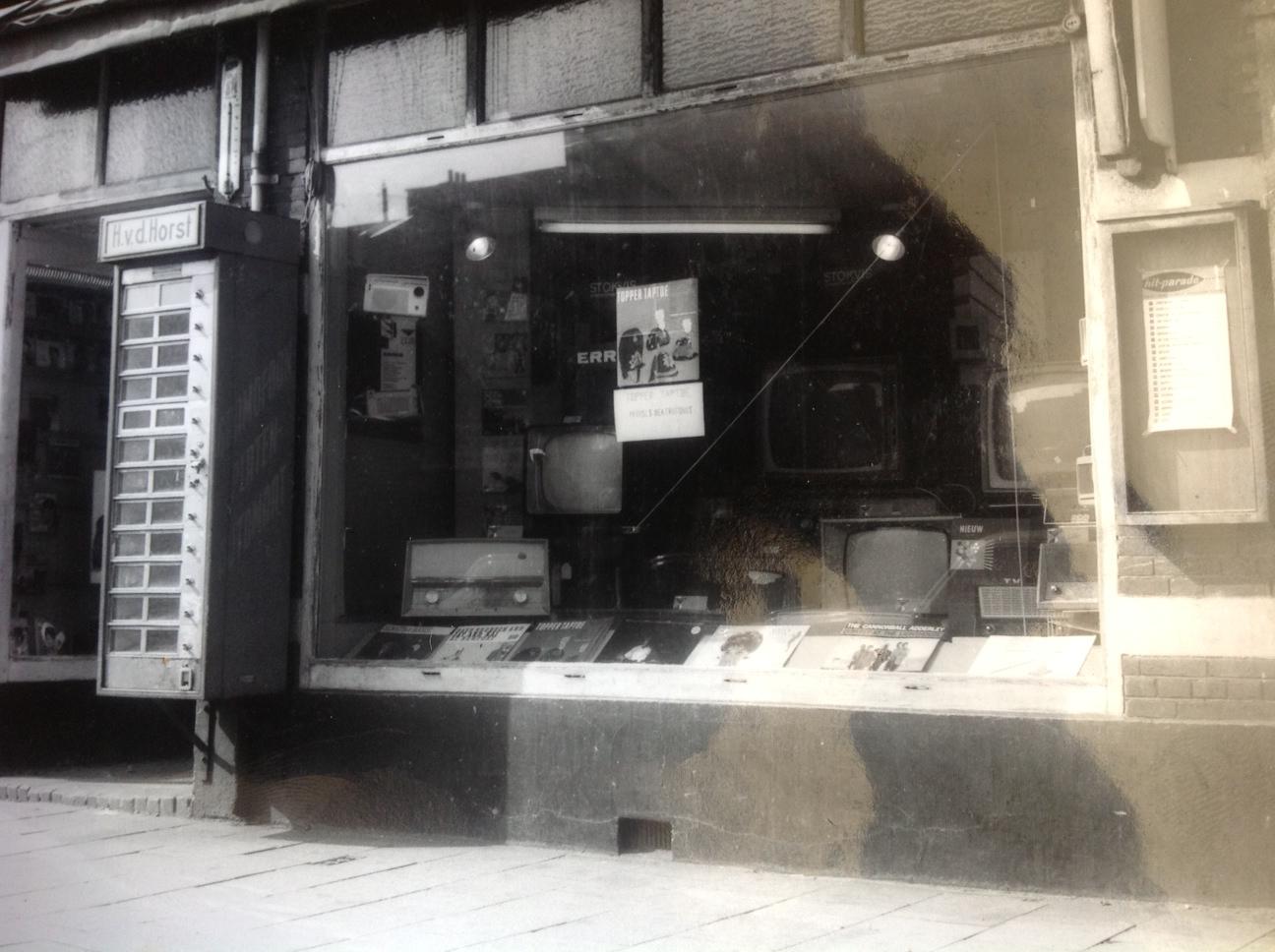 The H. v.d. Horst shopfront with records and a hit parade chart in the window.